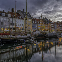 Buy canvas prints of Christmas lights reflect in Copenhagen Nyhavn canal at dusk by Stig Alenäs