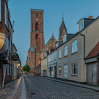 Buy canvas prints of The tower of Ribe cathedral at the end of an old s by Stig Alenäs