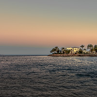 Buy canvas prints of White Villa on a small island with palms and a bri by Stig Alenäs