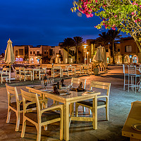 Buy canvas prints of tables and chairs at night on a  seaside walk in E by Stig Alenäs