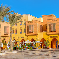 Buy canvas prints of Egyptian piazza with colourful houses and a restau by Stig Alenäs
