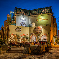 Buy canvas prints of A colourful picturesque restaurant illuminated at  by Stig Alenäs