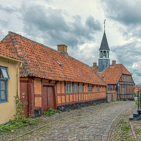 Buy canvas prints of The old town of Ebeltoft with a  cobblestone-stree by Stig Alenäs