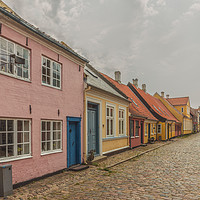 Buy canvas prints of  an idyllic street with cobblestone and colourful  by Stig Alenäs