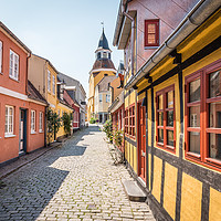 Buy canvas prints of An alleyway with cobblestones and half timbered ho by Stig Alenäs