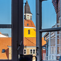 Buy canvas prints of a coffee mug and a laptop in the window frame and a yellow tower by Stig Alenäs
