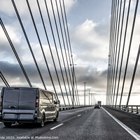 Buy canvas prints of A black van driving over the Øresund Bridge betwee by Stig Alenäs
