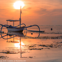 Buy canvas prints of A traditional balinese fishing boat at sunrise by Stig Alenäs