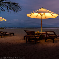 Buy canvas prints of Umbrellas and sunbeds on the beach at night by Stig Alenäs