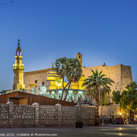 Buy canvas prints of The illuminated luxor temple at nigt with  glowing brickwalls by Stig Alenäs