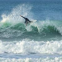 Buy canvas prints of Surfer riding crest of wave, Fistral, Newquay, Cor by Mick Blakey