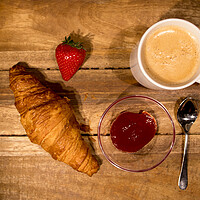 Buy canvas prints of Breakfast table with coffee croissants and jam by Erik Lattwein