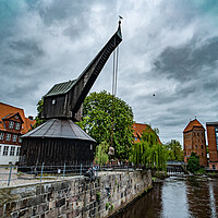 Buy canvas prints of Old crane at the Historic city of Luneburg Germany - CITY OF LUENEBURG, GERMANY - MAY 10, 2021 by Erik Lattwein