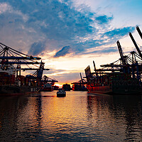 Buy canvas prints of Sunset over the port of Hamburg - CITY OF HAMBURG, GERMANY - MAY 10, 2021 by Erik Lattwein