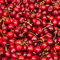 Buy canvas prints of Fresh cherries for sale on the market - city photography by Erik Lattwein