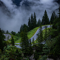 Buy canvas prints of Deep clouds over the fir trees in the Austrian Alps - Vorarlberg region by Erik Lattwein
