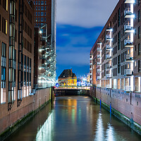 Buy canvas prints of Wonderful warehouse district in Hamburg by night by Erik Lattwein