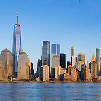 Buy canvas prints of Panoramic skyline of Manhattan on a sunny day - travel photography by Erik Lattwein