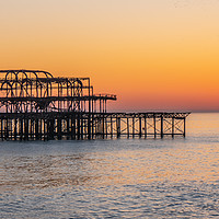 Buy canvas prints of Old Brighton Pier in the sunset by Erik Lattwein
