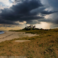 Buy canvas prints of Bamburgh Castle - A storm is brewing by Simon Marlow