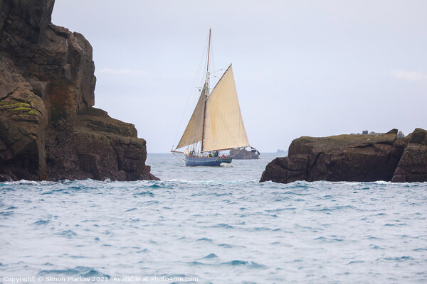 Yacht sailing between rocks in the Isles of Scilly Picture Board by Simon Marlow