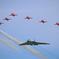Buy canvas prints of The Majestic Vulcan and Red Arrows in their Final  by Simon Marlow