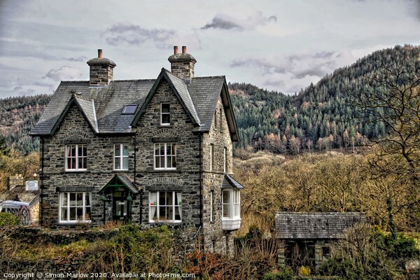 Cottage by the river in Betws-y-Coed, North Wales Picture Board by Simon Marlow