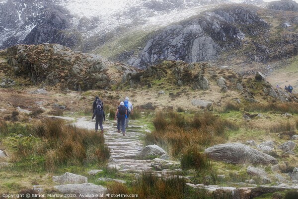 Hiking at Llyn Idwal in Snowdonia National Park, W Picture Board by Simon Marlow