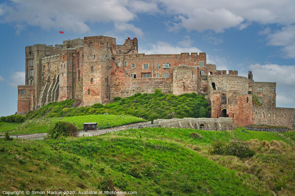 Bamburgh Castle in Northumberland Picture Board by Simon Marlow