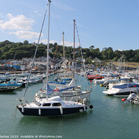 Buy canvas prints of Boats in the Lyme Regis harbour moorings by Simon Marlow