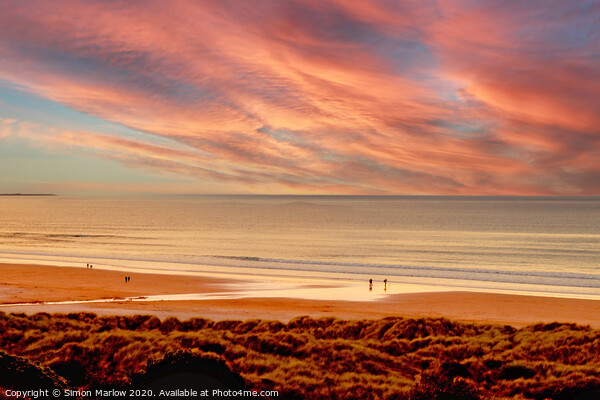 Sunset overlooking Bamburgh Beach Picture Board by Simon Marlow