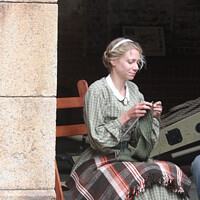 Buy canvas prints of Woman Knitting, Civil War reenactment, San Francisco by Arun 