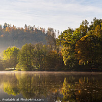 Buy canvas prints of Lake fog landscape with Autumn foliage and tree reflections in Styria, Thal, Austria. Autumn season theme. by Przemek Iciak