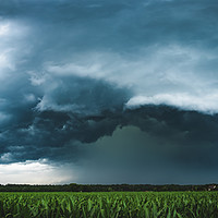 Buy canvas prints of Panoramic view of dark thunderstorm clouds approac by Przemek Iciak