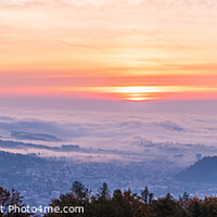Buy canvas prints of Panorama of Graz city covered if fog on autumn morning during sunraise. by Przemek Iciak