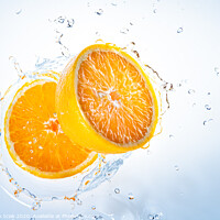 Buy canvas prints of Two halves of orange fruit splashing into clear water. by Przemek Iciak