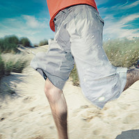 Buy canvas prints of blurry photo of man legs running through sand by federico stevanin