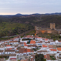 Buy canvas prints of Mertola drone aerial view of the city and landscape with Guadiana river and medieval historic castle on the top in Alentejo, Portugal by Luis Pina