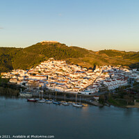 Buy canvas prints of Aerial drone view of Sanlucar de Guadiana in Spain, from Alcoutim in Portugal by Luis Pina