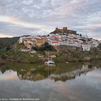 Buy canvas prints of Mertola city view at sunset with Guadiana river in Alentejo, Portugal by Luis Pina