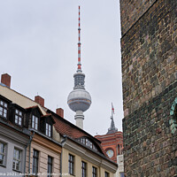 Buy canvas prints of Berlin TV Tower on a cloudy day seen from Nikolaikirche Church by Luis Pina
