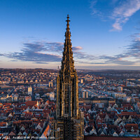 Buy canvas prints of Aerial shot taken with a drone of Ulm Minster at sunrise, in Germany by Luis Pina