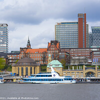 Buy canvas prints of View of St. Pauli's Pier Landungsbrücken station tower with buildings and boats in Hamburg by Luis Pina