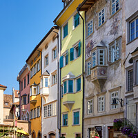 Buy canvas prints of Street in Bolzano with traditional typical antique houses by Luis Pina