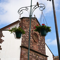 Buy canvas prints of Funchal Cathedral church seen from the street with flowers hanging in Madeira by Luis Pina
