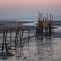 Buy canvas prints of Carrasqueira Palafitic Pier in Comporta, Portugal at sunset by Luis Pina