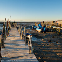 Buy canvas prints of Carrasqueira Palafitic Pier in Comporta, Portugal with fishing boats by Luis Pina