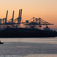 Buy canvas prints of Sines container port terminal with cranes at sunset, in Portugal by Luis Pina