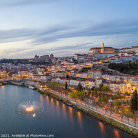 Buy canvas prints of Coimbra drone aerial city view at sunset with colorful fountain in Mondego river and beautiful historic buildings, in Portugal by Luis Pina