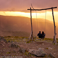 Buy canvas prints of Romantic couple social distancing swinging on a Swing baloico in Lousa mountain, Portugal at sunset by Luis Pina